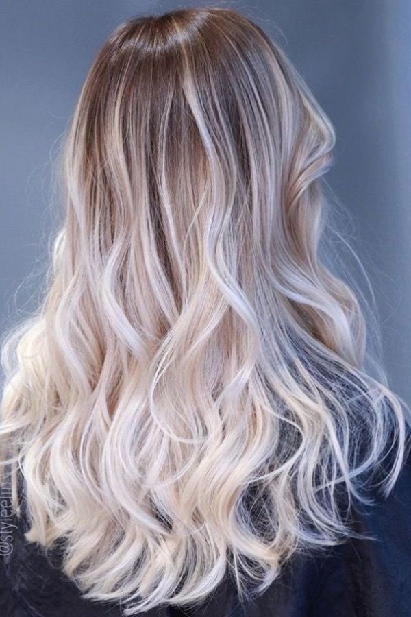 Fashionable ombre. Hair coloring with dark roots